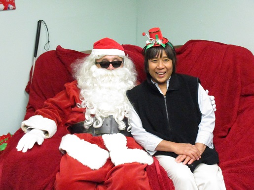 A woman posing with Blind Santa